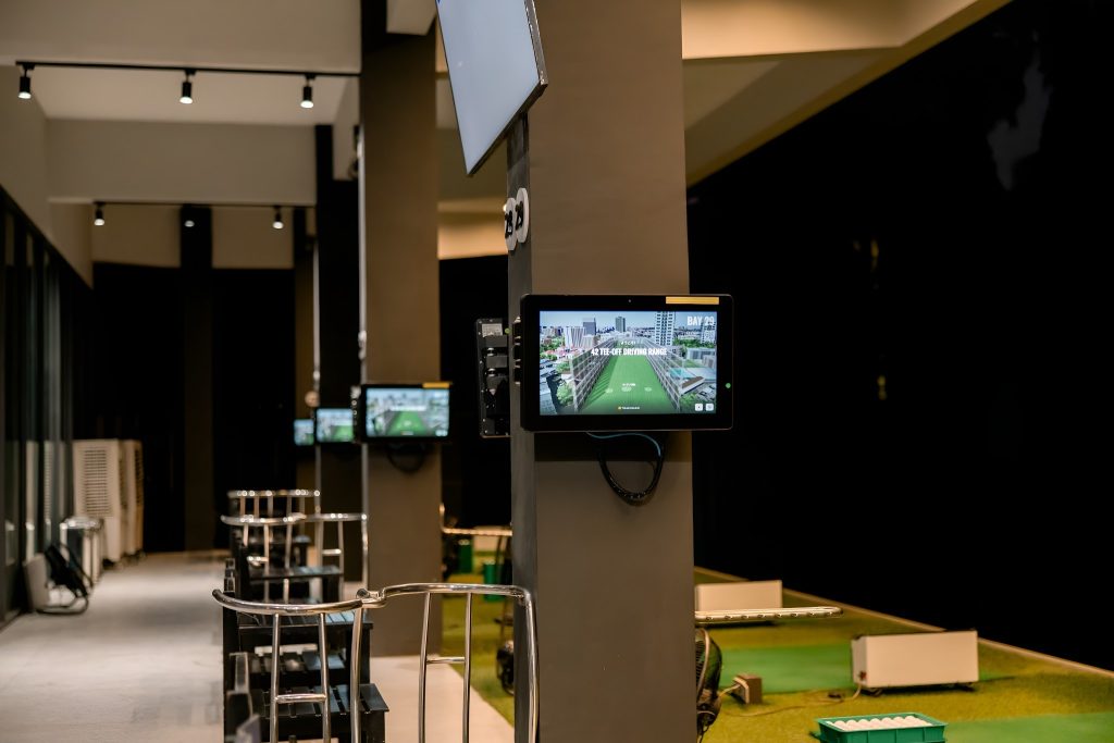 TrackMan launch monitor technology screen accelerating golf swing improvement with real-time data.